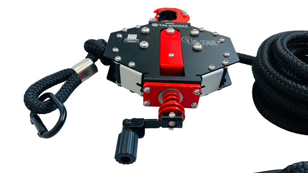 Angled view of the Q-Tail trainer with its adjustment knob and rope loop handle